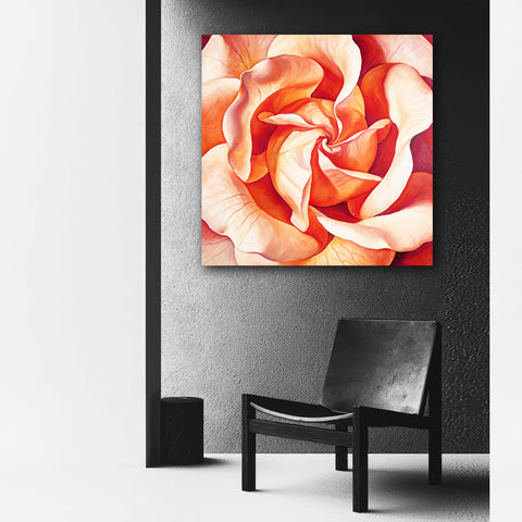 Extra-large floral artwork on a wall above a black chair.
